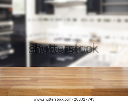Empty wooden table and blurred kitchen background, product display