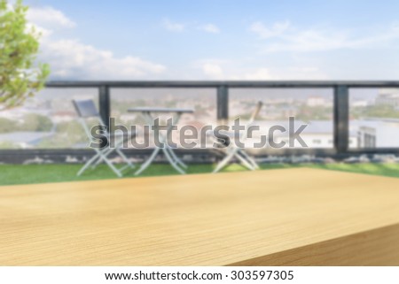 Empty wooden table and chair and a table on terrace  background, product display montage
