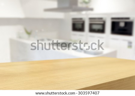 Empty wooden table and blurred kitchen background, product display montage