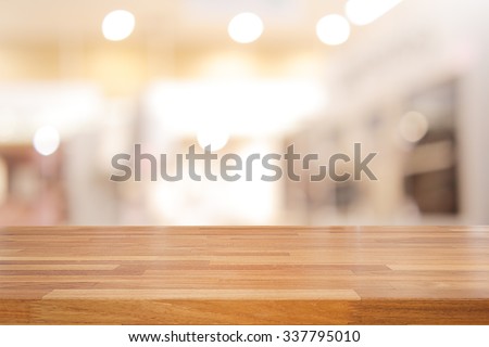Empty wooden table and interior background, product display,blurred store with bokeh