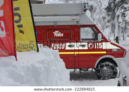 Madesimo, Italy, December 26, 2013: Winter season. Italian Fire rescue vehicle  in action with snow chain