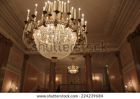 Venice, Italy, June 5 2014: Venice la Fenice Theatre chandelier, a beautiful pendant lamp in the centre foyer of the theatre