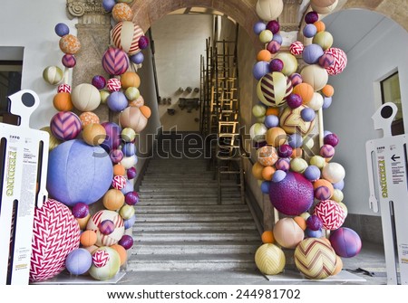 MILAN, ITALY - APR 8: University of Milan main staircase during the Milan Furniture fair on April 8 2014, with a colorful design installation by Ferruccio Laviani of textile balls