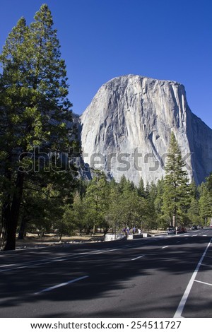 SIERRA NEVADA, USA - AUG 10 2013: Scenic view of El Capitolio rock formation in Sierra Nevada, from the street, in a sunny day in the summer season