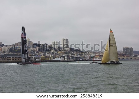 SAN FRANCISCO, USA - AUGUST 12 2013: Sailing in San Francisco. Sailing boat on the Pacific ocean with San Francisco Skyline in the background in a dull day.