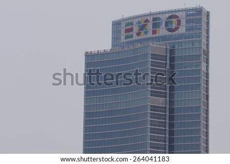 MILAN, ITALY - MARCH 21 2015:  Lombardy Region Palace in Milan, with the big Expo logo on the top, for the 2015 exhibition