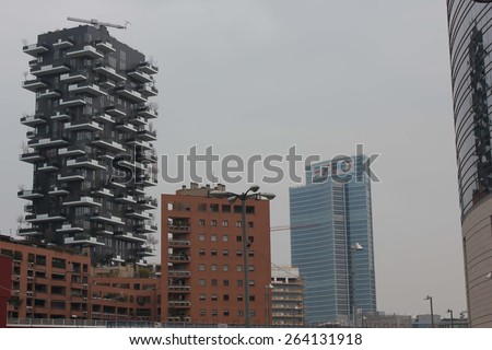 MILAN, ITALY - MARCH 21 2015: Bosco Verticale (Vertical Forest) complex building designed by Stefano Boeri, and the Palazzo Lombardia glass building, in the Porta Nuova district in Milan