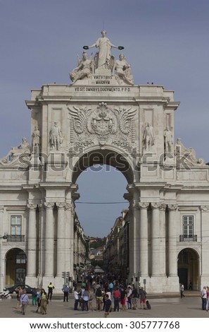 LISBON, PORTUGAL - OCTOBER 24 2014: Placa do Comercio in Lisbon (Commercial Square), with people walking around and the triumphal arch in the background