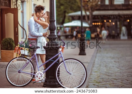 Summer holidays, bikes, love, wedding- couple with bicycles in the city.