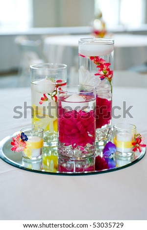 stock photo wedding centerpiece with floating candles and flowers