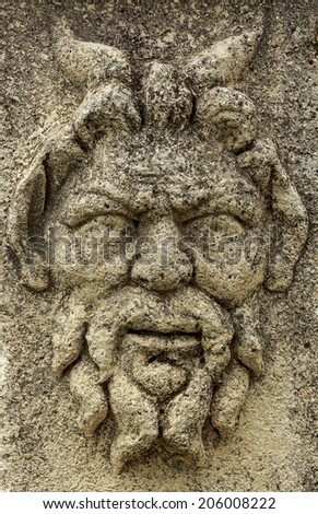 Dalmatian town of Zadar, Croatia. Ancient Roman God carved stone in forum