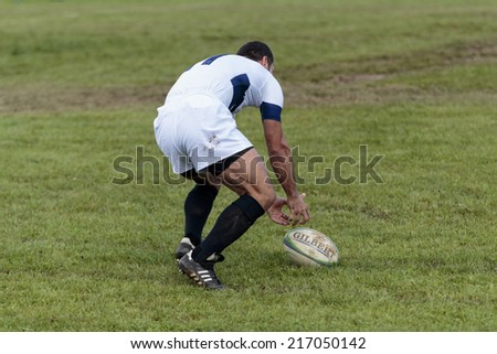 ZAGREB, CROATIA - SEPTEMBER 13, 2014: Rugby match Rugby Club Zagreb in white jersey and Rugby Club Sinj in black jersey. Unidentified player dropped the ball