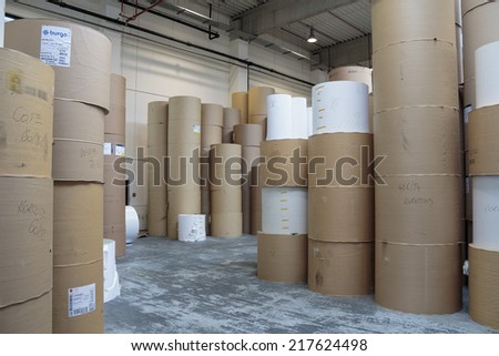ZAGREB, CROATIA - SEPTEMBER 16, 2014: View of huge rolls of paper in Printing house. Large printing house has great need for paper
