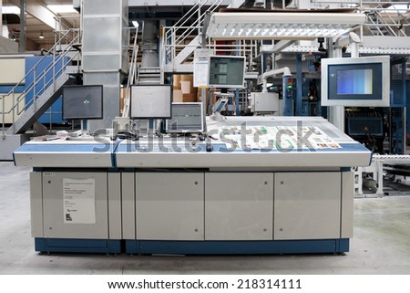 ZAGREB, CROATIA - SEPTEMBER 16, 2014: View of rotation Koenig Bauer machine in Printing house. The control desk of the printing press.