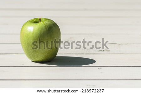 Granny Smith green apple on the white board background, Copy space
