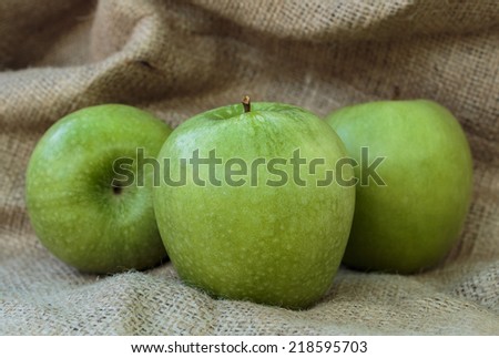 Granny Smith green apples on the burlap background