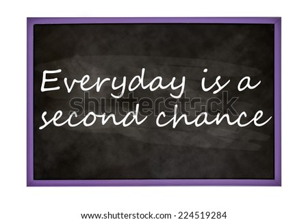 Everyday is a second chance text on a blackboard isolated on white