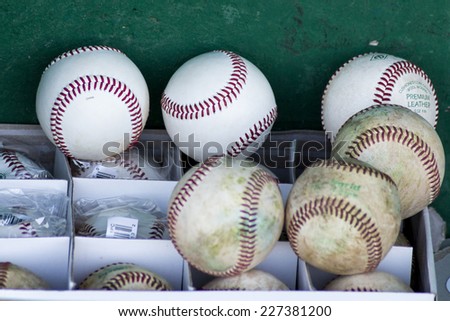 ZAGREB. CROATIA - OCTOBER 12, 2014: Baseball match Baseball Club Zagreb in blue jersey and Baseball Club Olimpija in dark blue jersey. New and old baseball balls in box during the game