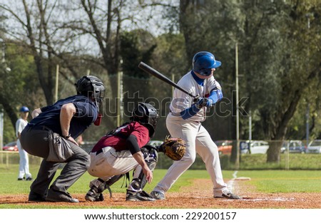 ZAGREB, CROATIA - OCTOBER 11, 2014: Baseball match Baseball Club Zagreb in white jersey and Baseball Club Medvednica in red jersey. Unidentified baseball batter preparing himself to hit the ball