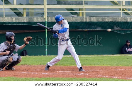 ZAGREB. CROATIA - OCTOBER 04, 2014: Baseball match Baseball Club Zagreb in white jersey and Baseball Club Karlovac in grey jersey. Unidentified baseball batter is about to hit the ball