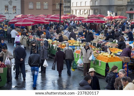ZAGREB, CROATIA - DECEMBER 13, 2014: Customers and sellers at Dolac, the famous open air farmer's market of agricultural products in Zagreb, one of city's most notable landmarks.