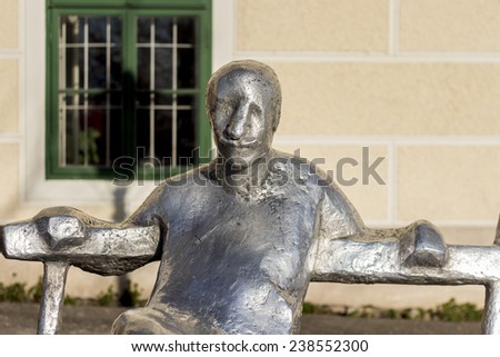 Metal statue on bench