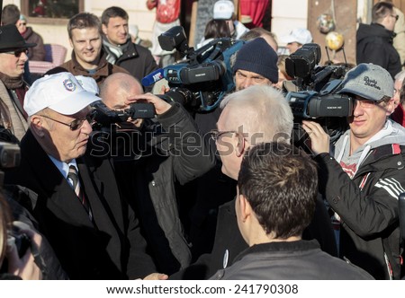 SAMOBOR, CROATIA - JANUARY 04, 2015: Ivo Josipovic the third President of Croatia on the promotion for the next presidential election in Croatia. The President is interact with people.