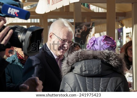SAMOBOR, CROATIA - JANUARY 04, 2015: Ivo Josipovic the third President of Croatia on the promotion for the next presidential election in Croatia. The President is interacting with people.