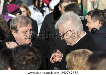 SAMOBOR, CROATIA - JANUARY 04, 2015: Ivo Josipovic the third President of Croatia on the promotion for the next presidential election in Croatia. The President is about to shake hand with civilian.