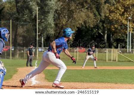 ZAGREB. CROATIA - OCTOBER 12, 2014: Baseball match Baseball Club Zagreb in blue jersey and Baseball Club Olimpija in dark blue jersey. Unidentified baseball runner