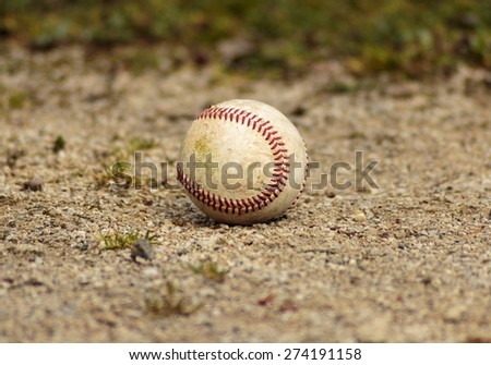 Baseball ball on gravel
