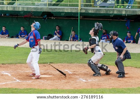 ZAGREB, CROATIA - MAY 03, 2015: Baseball match Baseball Club Zagreb in blue jersey and Baseball Club Pirates in white jersey. Baseball players looking as the ball fly through the air