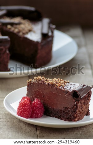 Creamy chocolate cake on white plate