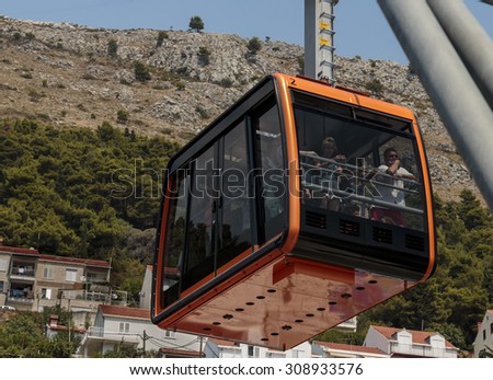 DUBROVNIK, CROATIA - AUGUST 05, 2015: Tourists at Cable car which connects Dubrovnik and mountain Srdj above town.