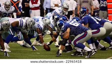 DALLAS, TEXAS - DECEMBER 14, 2008: Eli Manning and the NY Giants lineup against the Dallas  Cowboys in the Texas Stadium.