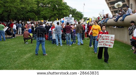 DALLAS - APRIL 15: A crowd gathers to protest big government and increased taxes in Dallas, Texas in front of City Hall on US Tax Day April 15, 2009.