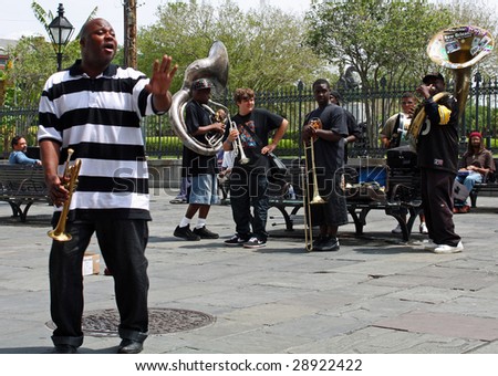 NEW ORLEANS, LOUISIANA - APRIL 13: A jazz band plays in Jackson Square April 13, 2009 in New Orleans, Louisiana after recovery from hurricane Katrina just before the Jazz and Heritage Festival.