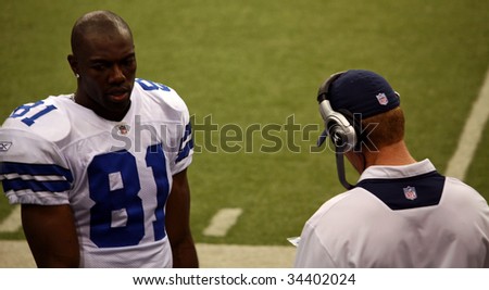 DALLAS - DEC 14: Taken in Texas Stadium on Sunday, December 14, 2008. Dallas Cowboys receiver Terrell Owens and coach Jason Garrett on the sideline during a game with the NY Giants.