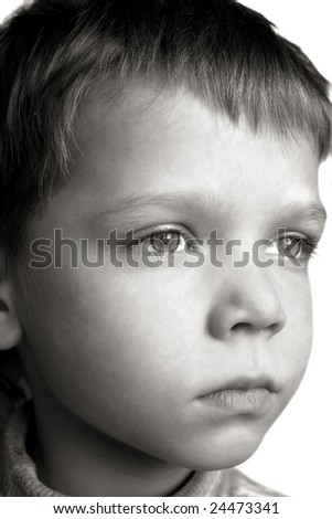 Black and white face of serious boy isolated over white background