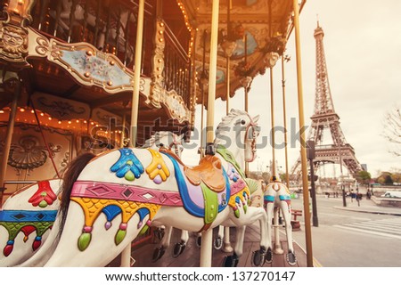 View of the carousel and the Eiffel Tower at sunset View of the carousel and the Eiffel Tower at sunset