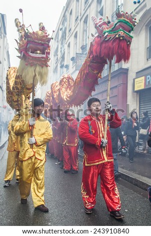 PARIS, FRANCE - FEBRUARY 10: Parade participants hold fairy dragon. Chinese New Year parade shown on February 10, 2013 in Paris, France