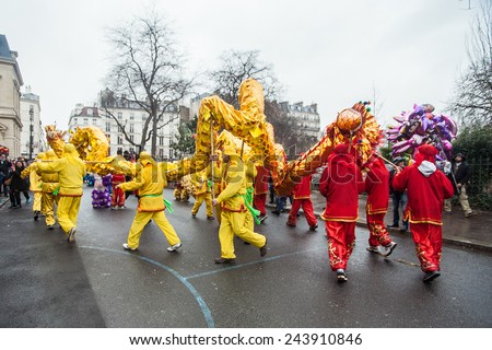 PARIS, FRANCE - FEBRUARY 10: Parade participants hold fairy dragon. Chinese New Year parade shown on February 10, 2013 in Paris, France