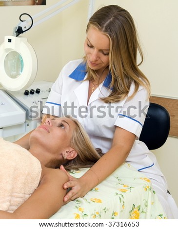 Woman and cosmetologist in the beauty salon