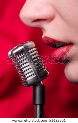 Lips girl and a miniature microphone in glamour style