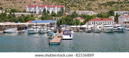 Panorama of yachts and boats moored among the mountains