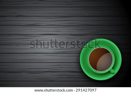 Top view of green cup of coffee or tea on the table black wood with space for text