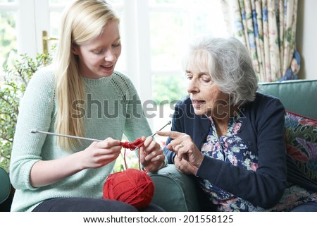Grandmother Showing Granddaughter How To Knit