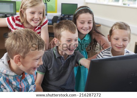 Group Of Elementary Pupils In Computer Class