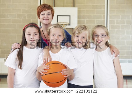 Teacher With Girls School Basketball Team