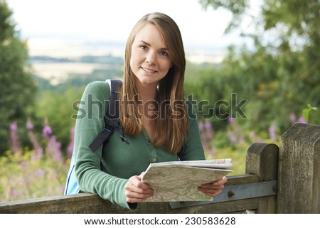 Portrait Of Young Woman Hiking In The Countryside